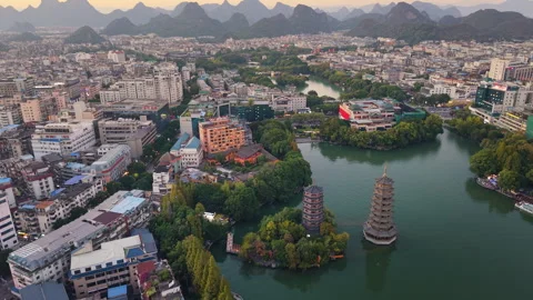 Sunset aerial view of Sun and Moon Twin Pagodas at Shanhu Lake, Guilin, China Video stock 330444843