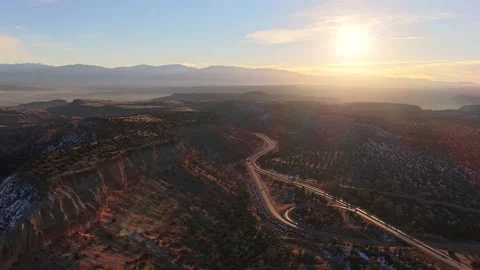 Sunset Aerial View of Winding Mountain Highway on Los Alamos Mesa Ridges in New Stock Footage 328714996
