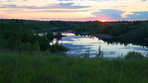 Sunset against the background of the river Stock Footage 94650645