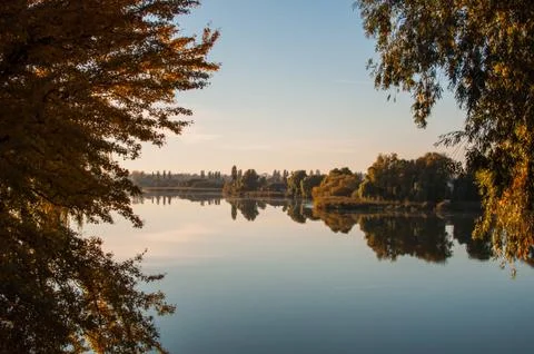 Sunset against the background of the river in September in the harvest season Stock Photos