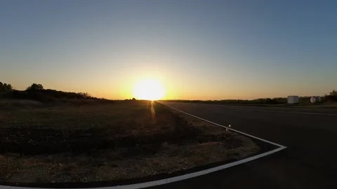 Sunset at the airfield, sunset on the road Stock Footage 183049315