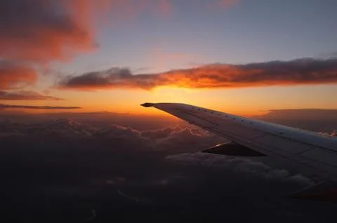 Sunset from the airplane Stock Photos