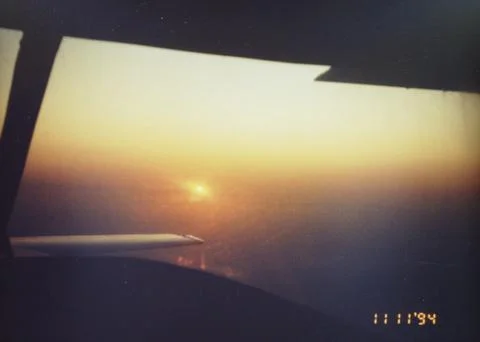 Sunset from Airplane thru rear Window Stock Photos