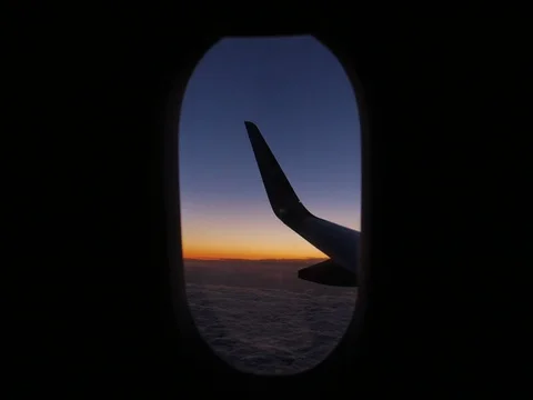 Sunset from airplane window wing Stock Footage 83547463