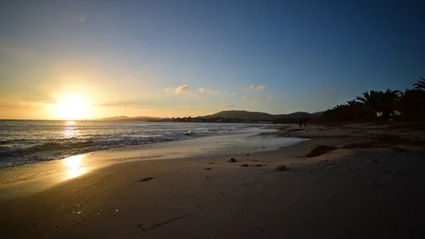 Sunset in Alghero shore on a clear day. Sardinia, Italy Stock Footage 126553565
