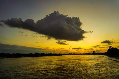 Sunset along the bank of the river. Stock Photos