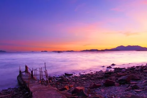Sunset along the coast under long exposure Stock-Fotos