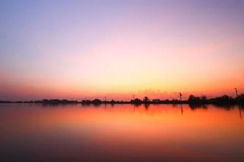 Sunset along the pond Stock Photos