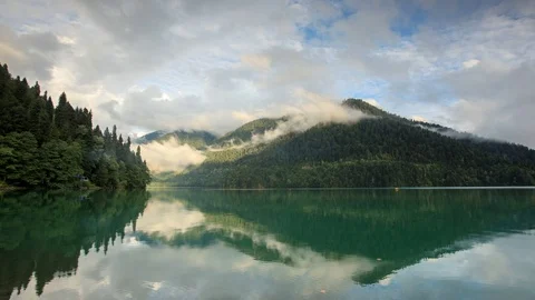 Sunset on an alpine lake Ritsa spring. Abkhazia. Full HD Stock Footage 73253736