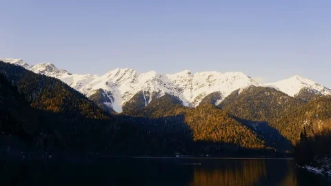 Sunset on an alpine lake Ritsa in spring. Abkhazia. Timelapse Stock Footage 110675386
