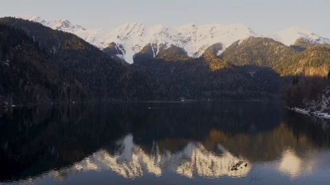 Sunset on an alpine lake Ritsa in spring. Abkhazia. Timelapse Stock Footage 110680266