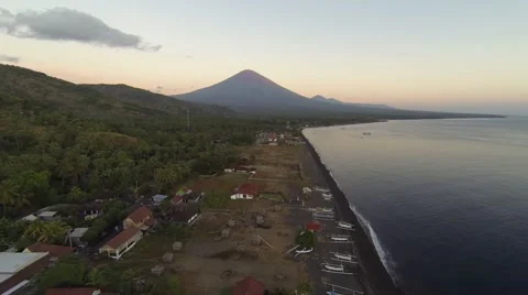 Sunset in Amed on the beach with view of Agung volcano, aerial shot Stock-Footage 65362613
