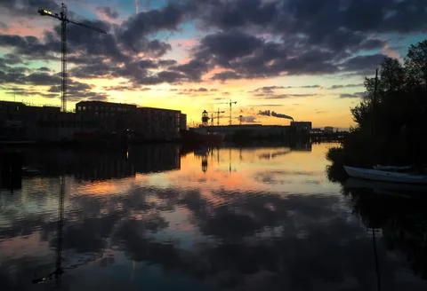 Sunset on Amsterdam harbor Stock Photos
