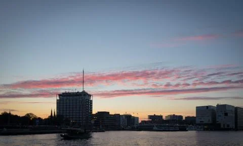 Sunset on Amsterdam harbor Stock Photos