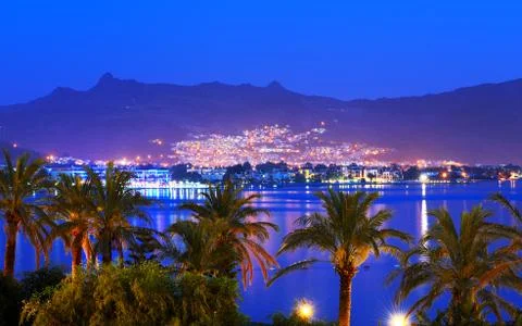 Sunset and beach with a view on bodrum resort in night illumination, turkey Stock Photos