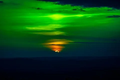 Sunset and beautiful light, sunlight illuminating the colorful sky, clouds Stock Photos