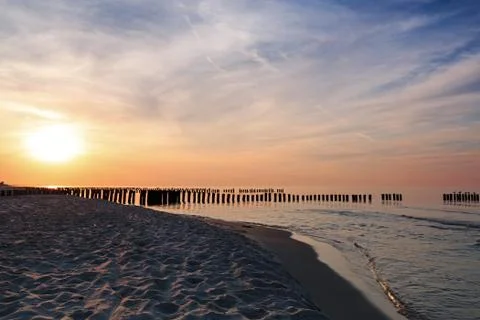 Sunset and breakwaters on the Baltic Sea. Long exposure Stock Photos