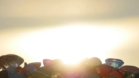 Sunset and bright sun shining with precious gemstones surface Stock Footage 76027445