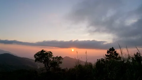 Sunset and clouds above mountain in evening, timelapse Stock Footage 89678385