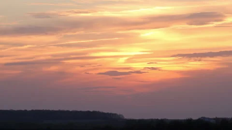 Sunset and clouds flying on red sky time-lapse Stock Footage 5329717