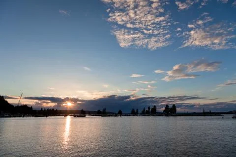 Sunset and clouds on a harbor Stock Photos