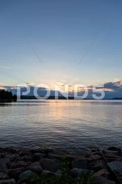 Sunset and clouds on a harbor Stock Photos