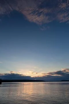 Sunset and clouds on a harbor Stock Photos