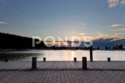 Sunset and clouds on a harbor Stock Photos