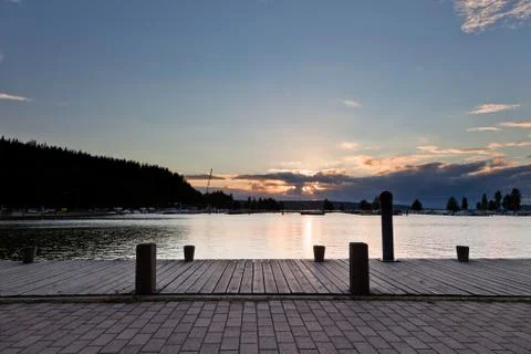 Sunset and clouds on a harbor Stock Photos