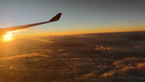 Sunset and Clouds Outside the Airplane Window Stock Footage 304304649