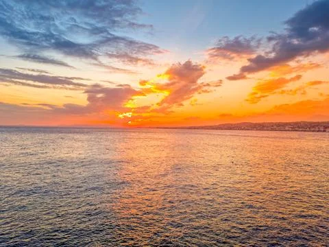 Sunset and clouds over the ocean Stock Photos