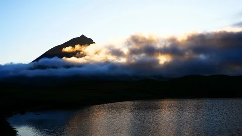 Sunset and clouds passing over Mount Pico, Azores Stock Footage 116465093