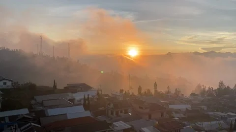 Sunset and clouds in the village Stock Footage 143384361
