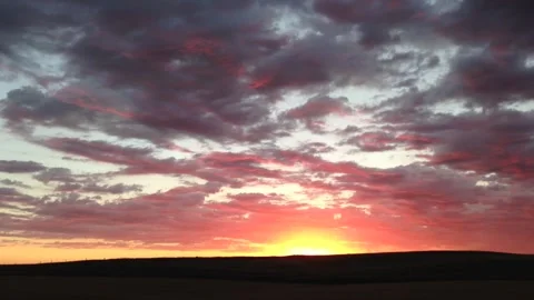 Sunset and colorful clouds slow pan right Video stock 265495048