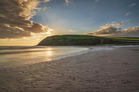 Sunset and dark clouds over the St Bees Heritage Coast near Whitehaven in Fotos Stock