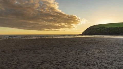 Sunset and dark clouds over the St Bees Heritage Coast near Whitehaven in Fotos Stock