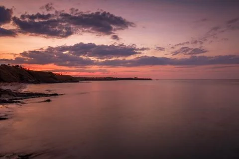 Sunset and dramatic set of clouds Stock Photos