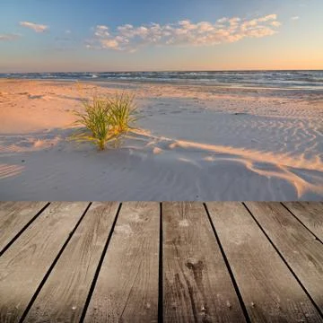 Sunset and empty wooden deck table. Stock Photos