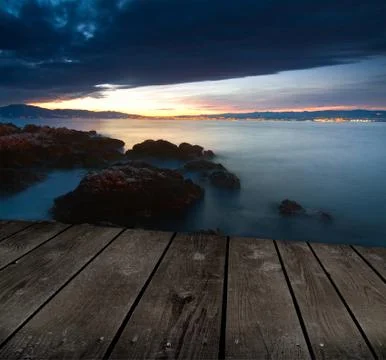 Sunset and empty wooden deck table. ready for product montage display. 스톡 사진