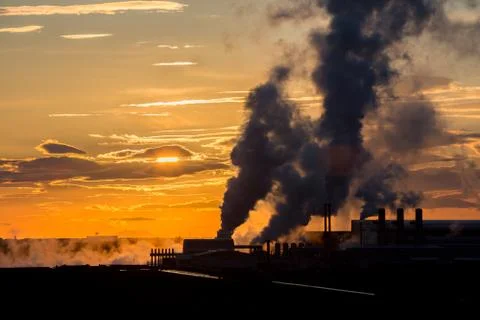 Sunset and factory Stock Photos