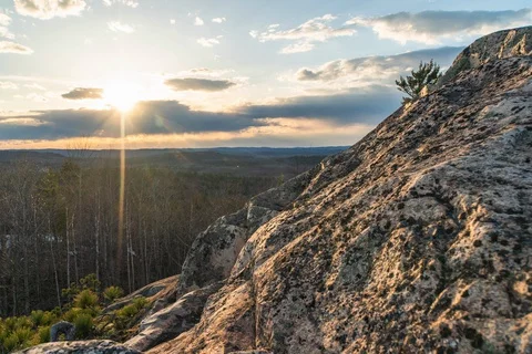 Sunset and granite rock Stock Footage 128159092