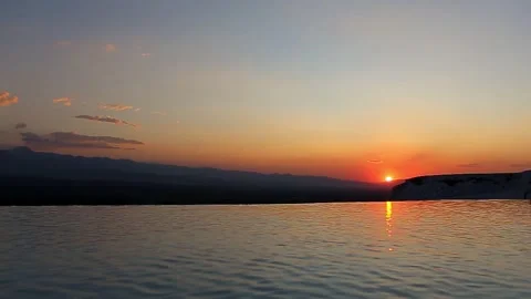 The sunset and its reflection in the lake. peaceful water view Stock Footage 139363291