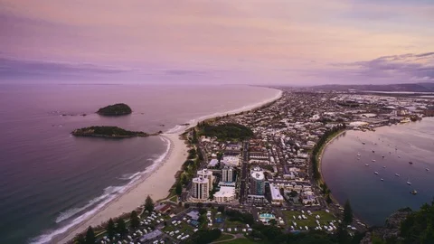 Sunset and lights coming on in Mount Maunganui Stockbeeldmateriaal 96679174