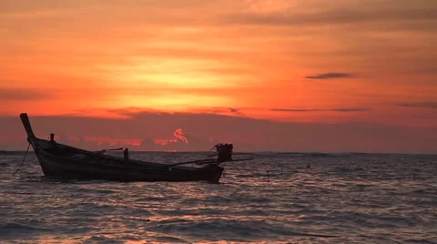 Sunset and long tail boat Stock Footage 63890648