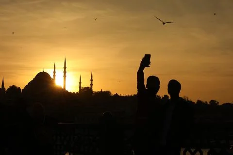 Sunset and men Stock Photos