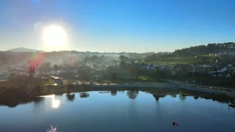 Sunset and mist in a small town by the lake 스톡 동영상 157079356