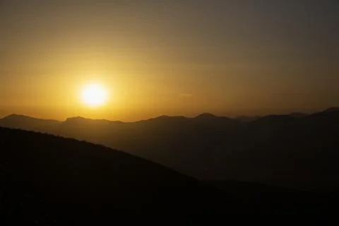 Sunset and mountains Stock Photos
