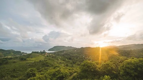 Sunset and moving clouds over the beach in Kuta Lombok Indonesia 4K time-lapse Stock-Footage 99785749