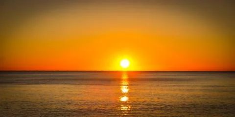 A sunset and the ocean Фото
