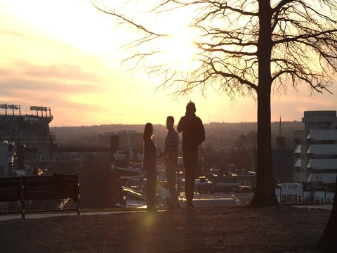 Sunset and People looking around 스톡 동영상 74849094